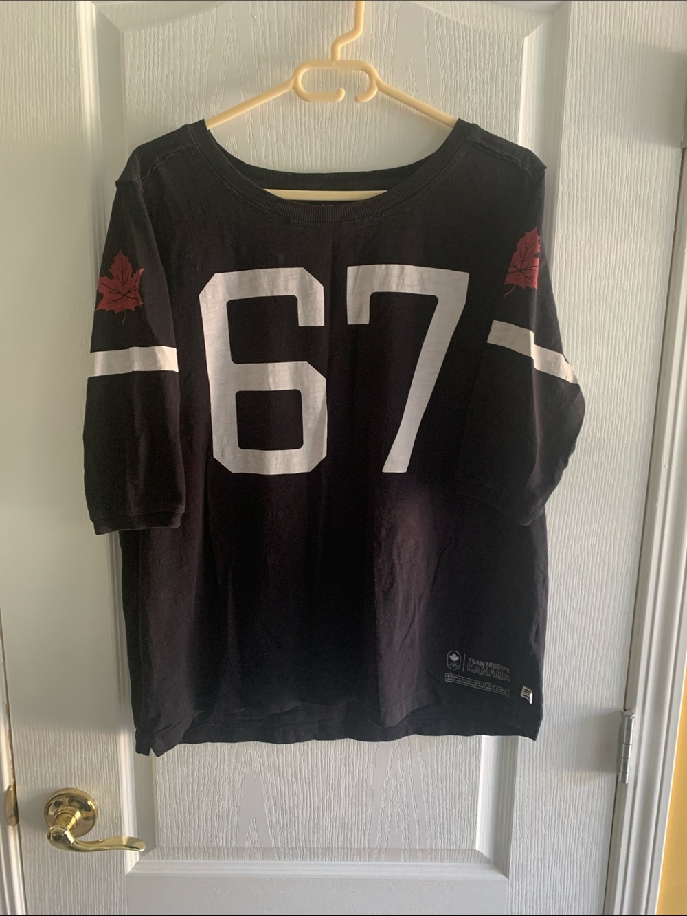 HBC - Black Women’s Elbow - Sleeve Graphic Team Canada Tee.